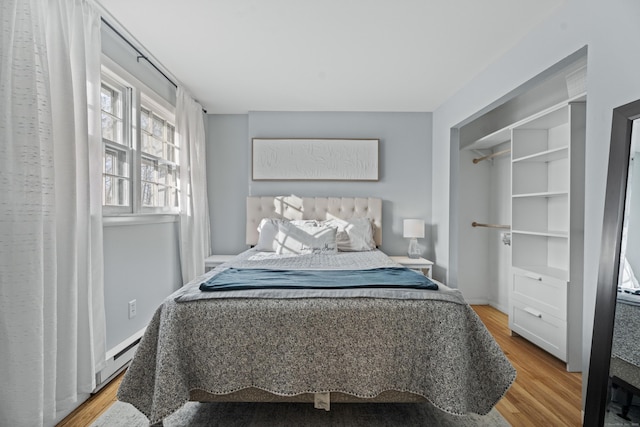 bedroom with light wood-type flooring