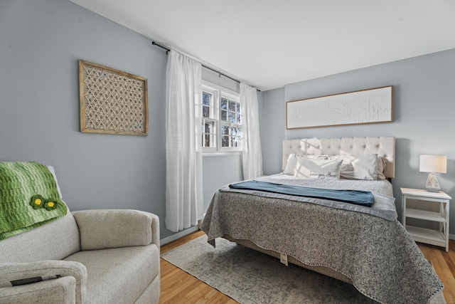 bedroom with wood finished floors