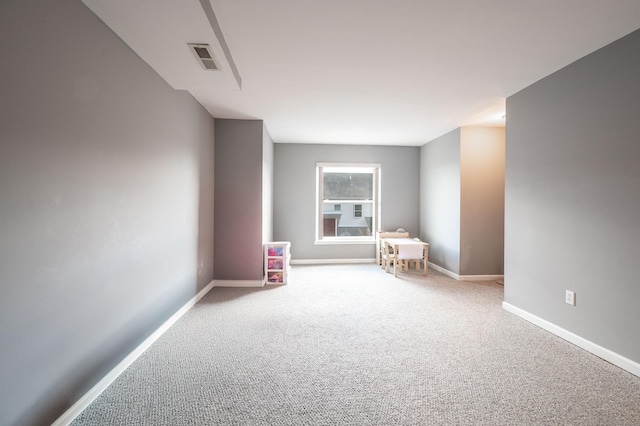 interior space featuring baseboards and visible vents