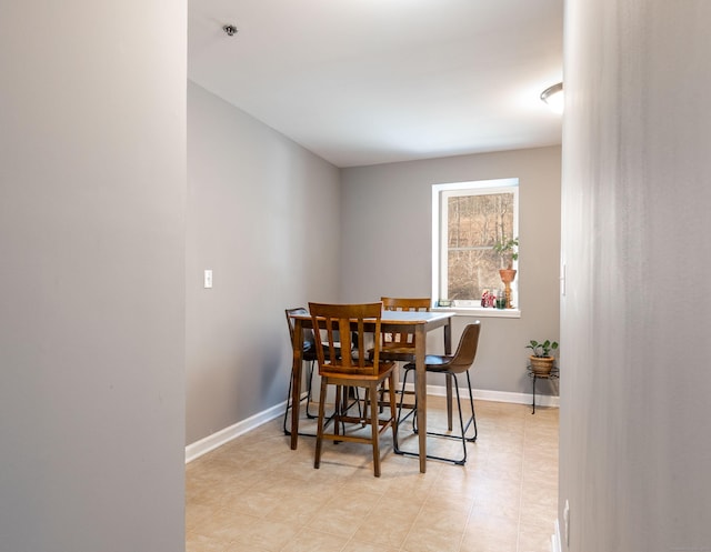 dining space with baseboards