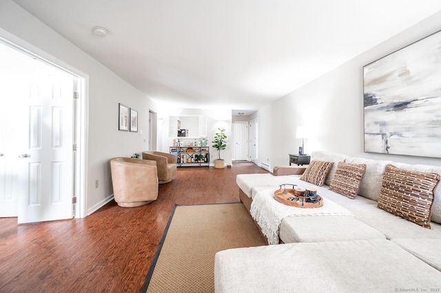 living room featuring wood finished floors and baseboards