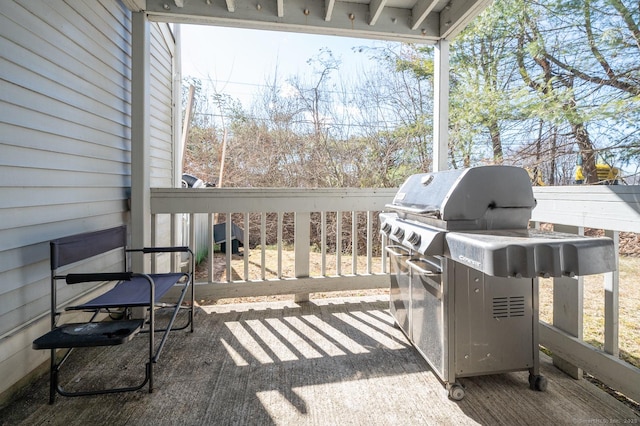 wooden deck with a grill