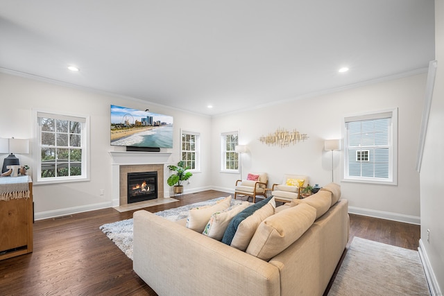 living area with baseboards and wood finished floors