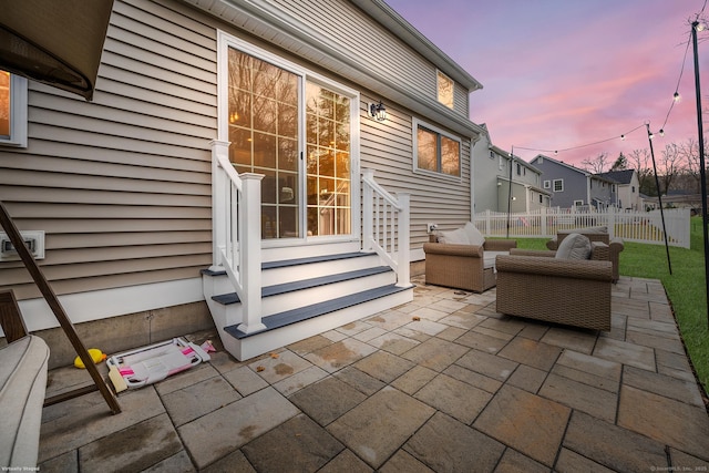 view of patio / terrace featuring entry steps and fence