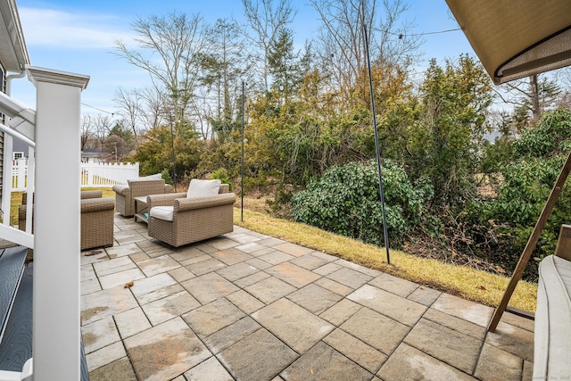 view of patio / terrace with outdoor lounge area and fence