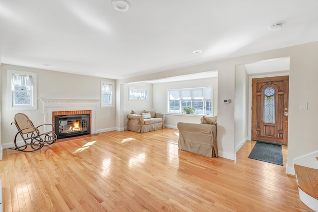 interior space featuring plenty of natural light, baseboards, and light wood-style floors