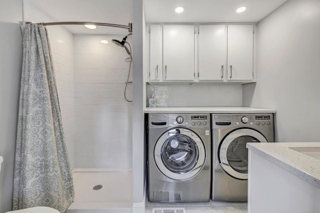 clothes washing area featuring recessed lighting, laundry area, and washer and clothes dryer