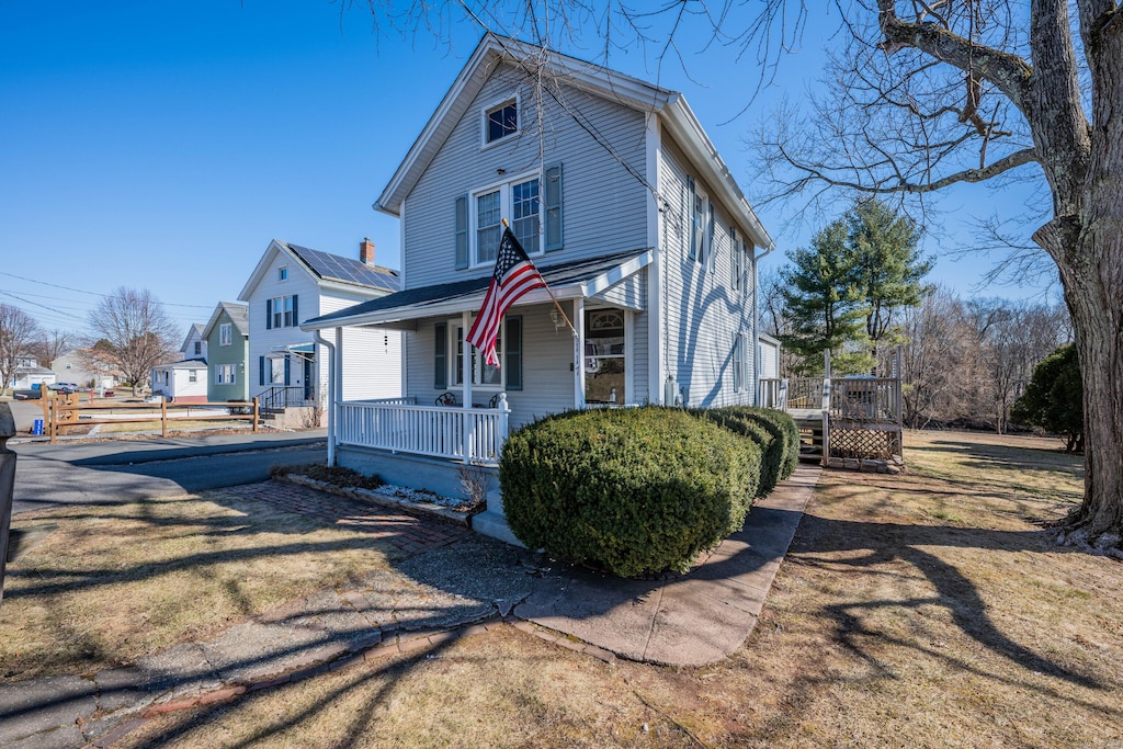 traditional style home featuring covered porch