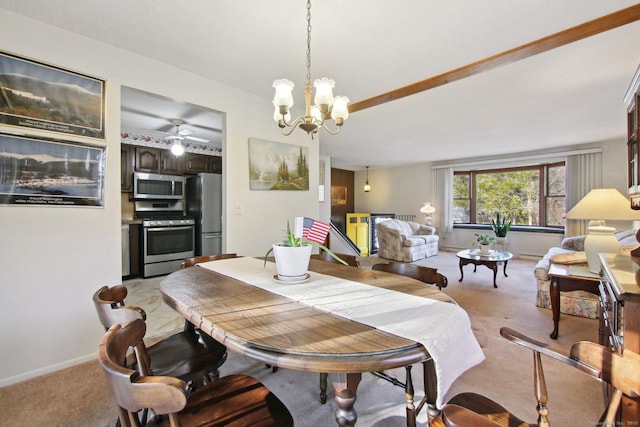 dining space featuring baseboards, light colored carpet, and ceiling fan with notable chandelier