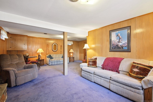 living area with wood walls and carpet flooring