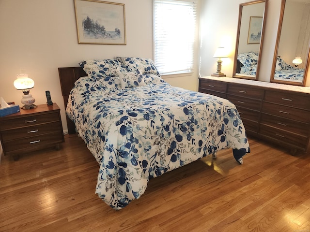 bedroom featuring wood finished floors