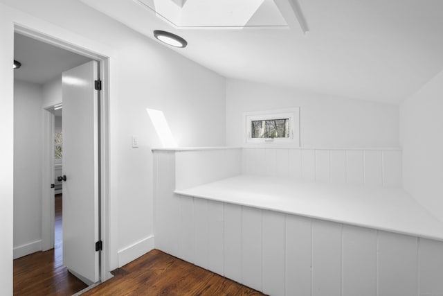 interior space with lofted ceiling and wood finished floors