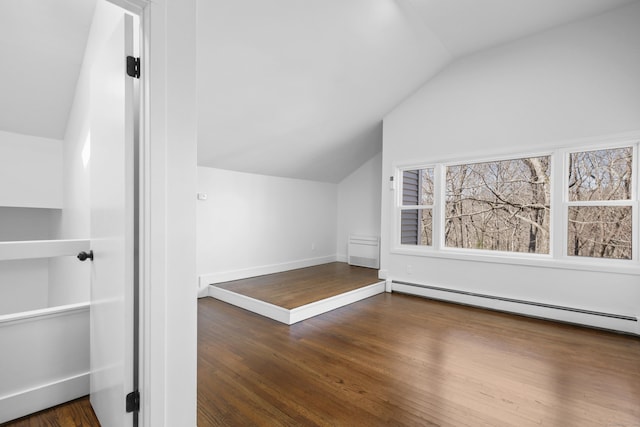 bonus room with a baseboard radiator, baseboards, wood finished floors, and vaulted ceiling