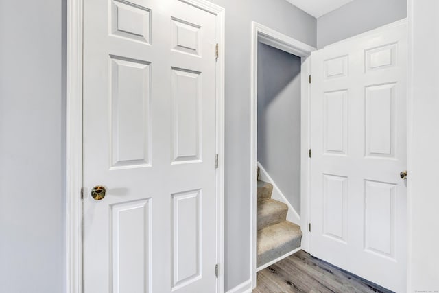 interior space with baseboards and wood finished floors