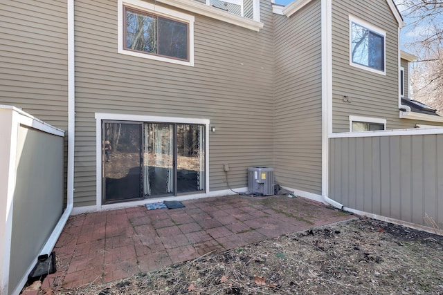 back of house featuring fence, central AC, and a patio area