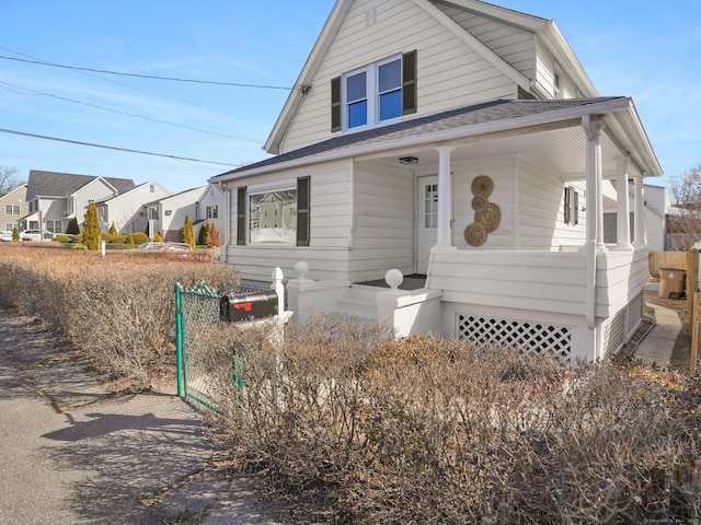 view of front of house with a shingled roof