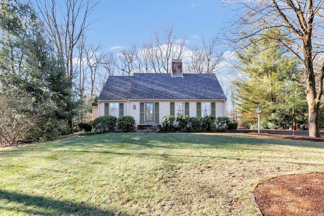 cape cod home featuring a chimney, a front lawn, and a shingled roof