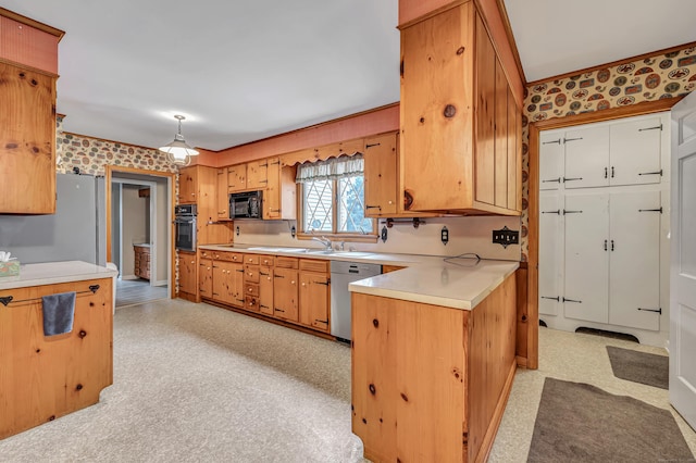 kitchen featuring oven, black microwave, light floors, dishwasher, and light countertops