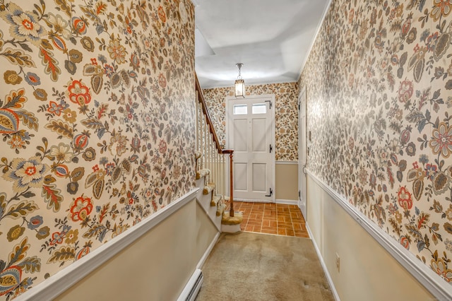 doorway to outside with wallpapered walls, carpet flooring, baseboards, and stairs