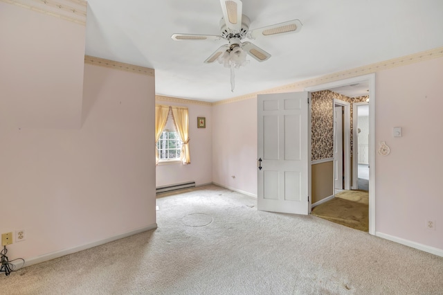 carpeted empty room featuring baseboards, baseboard heating, and ceiling fan