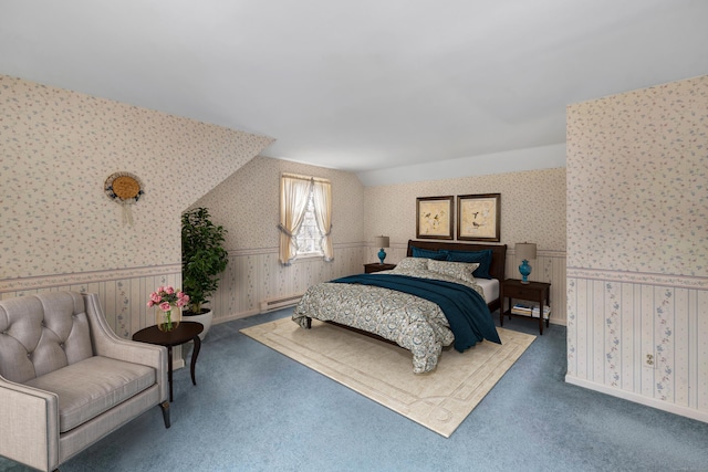 bedroom with a baseboard heating unit, carpet floors, a wainscoted wall, and wallpapered walls