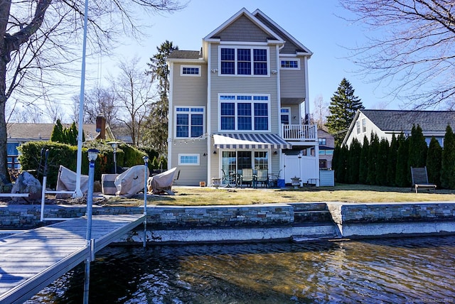 rear view of house with a water view