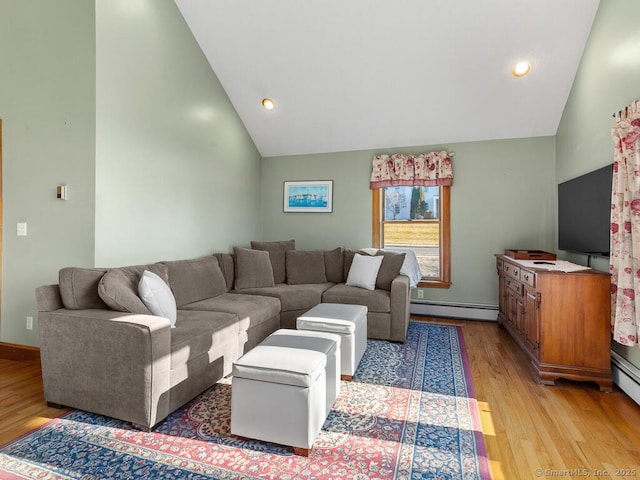 living area with baseboards, high vaulted ceiling, light wood-style flooring, recessed lighting, and a baseboard heating unit