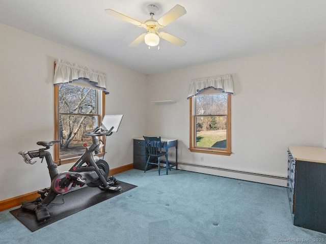 exercise area featuring carpet flooring, baseboards, a baseboard heating unit, and a ceiling fan