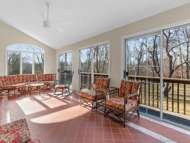 sunroom with lofted ceiling and ceiling fan