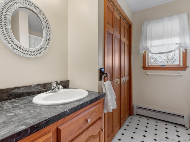 bathroom with tile patterned floors, vanity, and a baseboard radiator