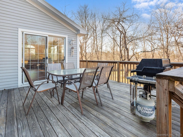 wooden deck with outdoor dining area