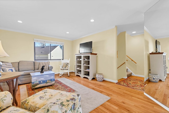 living room with ornamental molding, stairs, baseboards, and wood finished floors