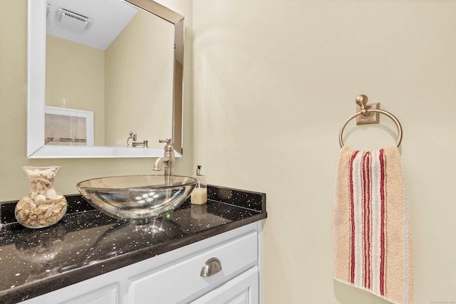 bathroom with visible vents and vanity