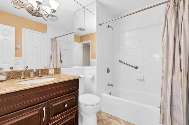 full bath featuring a notable chandelier, toilet, shower / tub combo, tile patterned flooring, and vanity