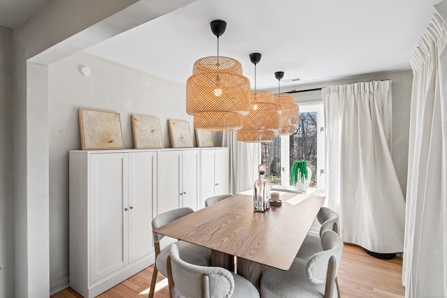 dining room with light wood-style floors