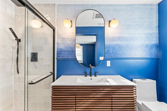 full bathroom with visible vents, toilet, a stall shower, and vanity