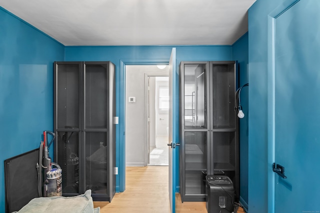 bedroom featuring wood finished floors and baseboards