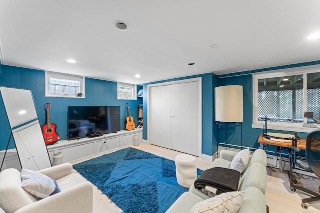 living room with recessed lighting and wood finished floors