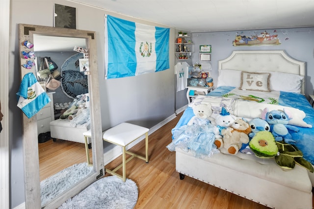 bedroom featuring wood finished floors