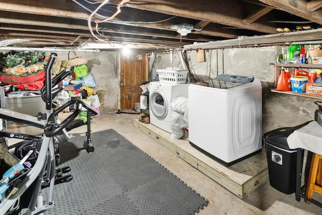 unfinished below grade area with washer and clothes dryer