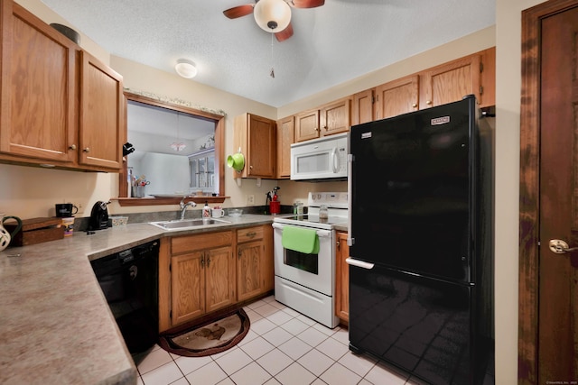 kitchen with black appliances, a sink, a textured ceiling, light tile patterned floors, and ceiling fan