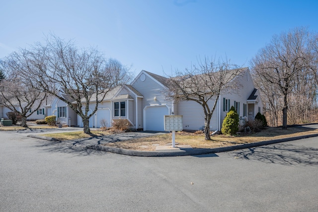 single story home with an attached garage and driveway