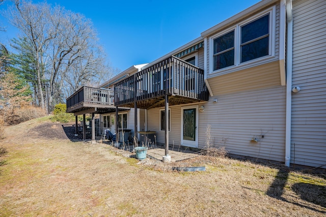 back of property with a wooden deck