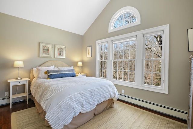 bedroom featuring baseboard heating, high vaulted ceiling, and wood finished floors