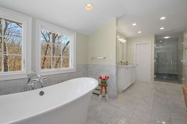 bathroom featuring vanity, plenty of natural light, marble finish floor, and a stall shower