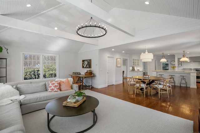 living room featuring lofted ceiling with beams, dark wood finished floors, recessed lighting, an inviting chandelier, and baseboards