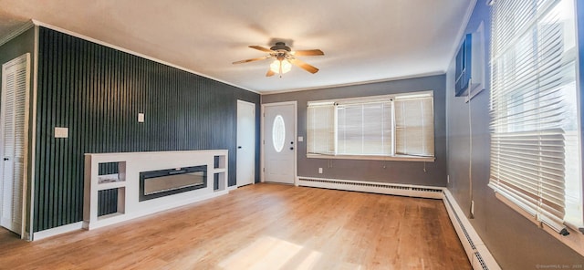 unfurnished living room with a glass covered fireplace, baseboard heating, ceiling fan, and wood finished floors