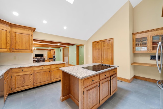 kitchen featuring a kitchen island, baseboards, black electric stovetop, lofted ceiling, and stainless steel dishwasher