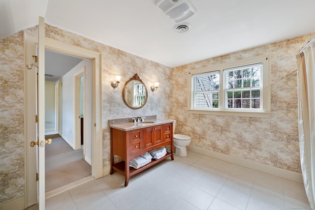 full bath with tile patterned flooring, wallpapered walls, baseboards, toilet, and vanity