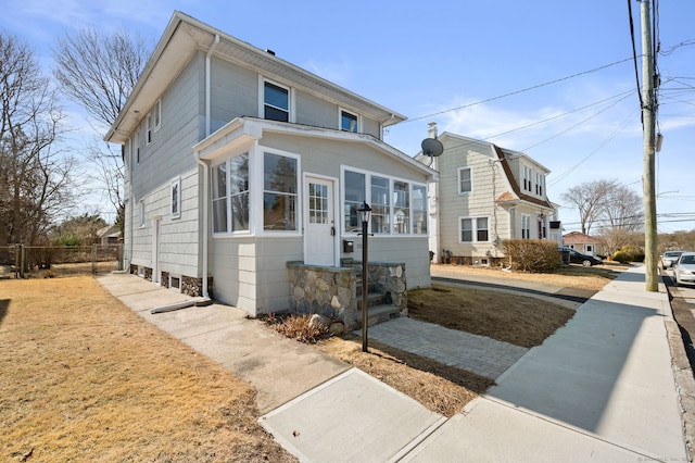 view of front of house with fence